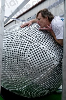 Checking the bottle cap  sculpture of a Rugby Ball - image by Liz March
