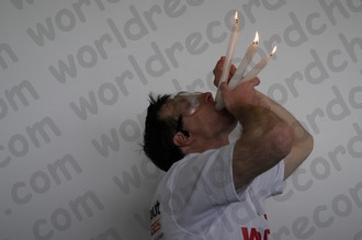 World Record for holding lit candles in your mouth - yes, you even need to practise at this