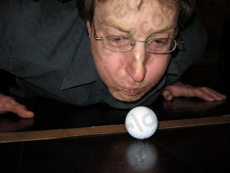Blowing a golf ball into the Guinness World Records