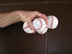 How many baseballs
                  can you hold in your hand palm down for a world
                  record?